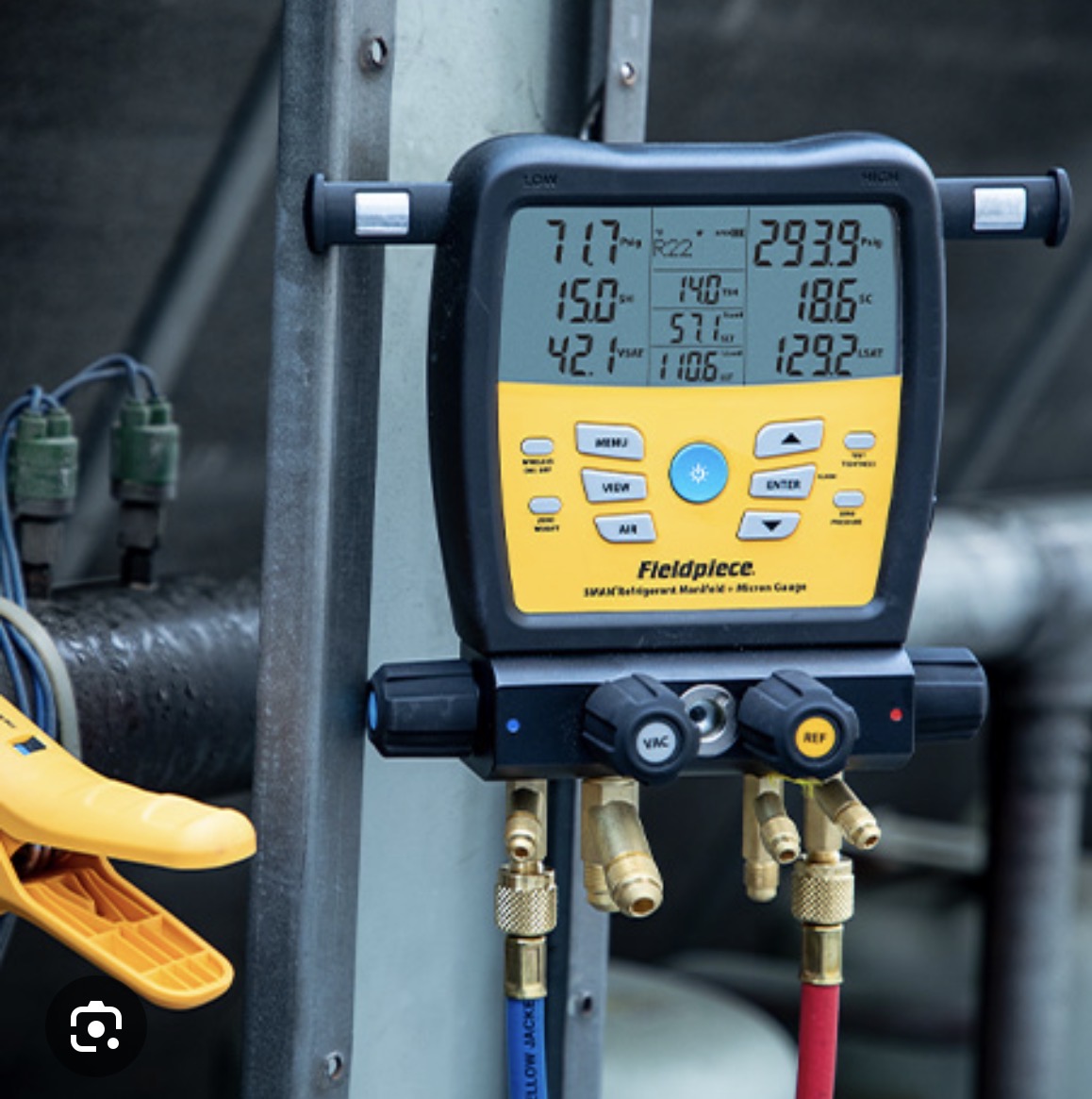Fieldpiece SMAN digital refrigerant manifold connected to service hoses