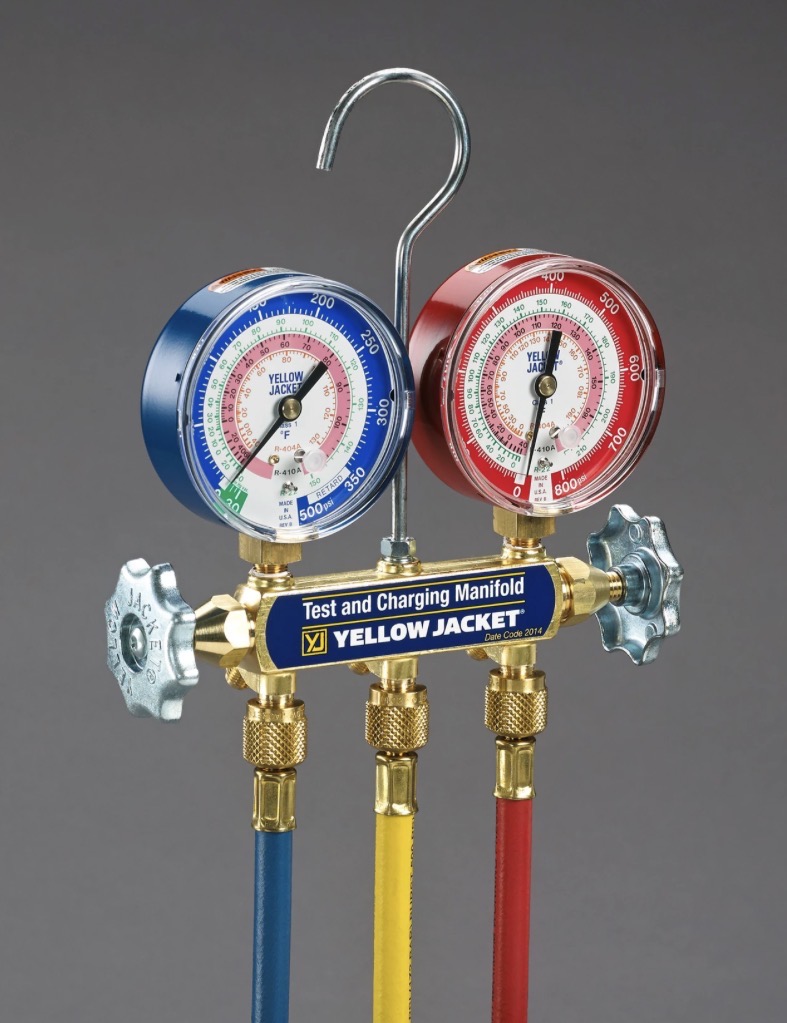 Yellow Jacket test and charging manifold with blue and red gauges and three colored hoses